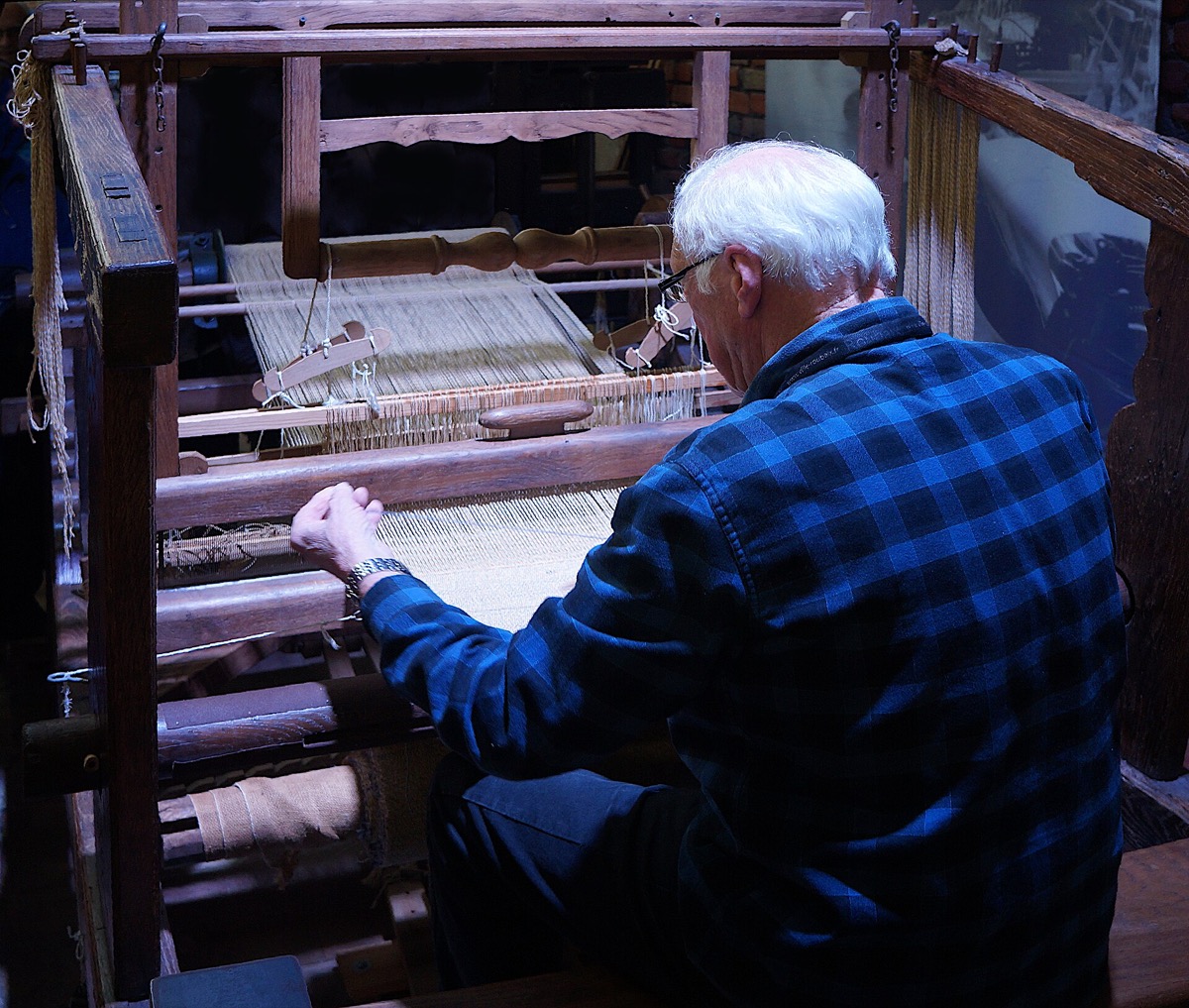 A loom warped with coloured yarn